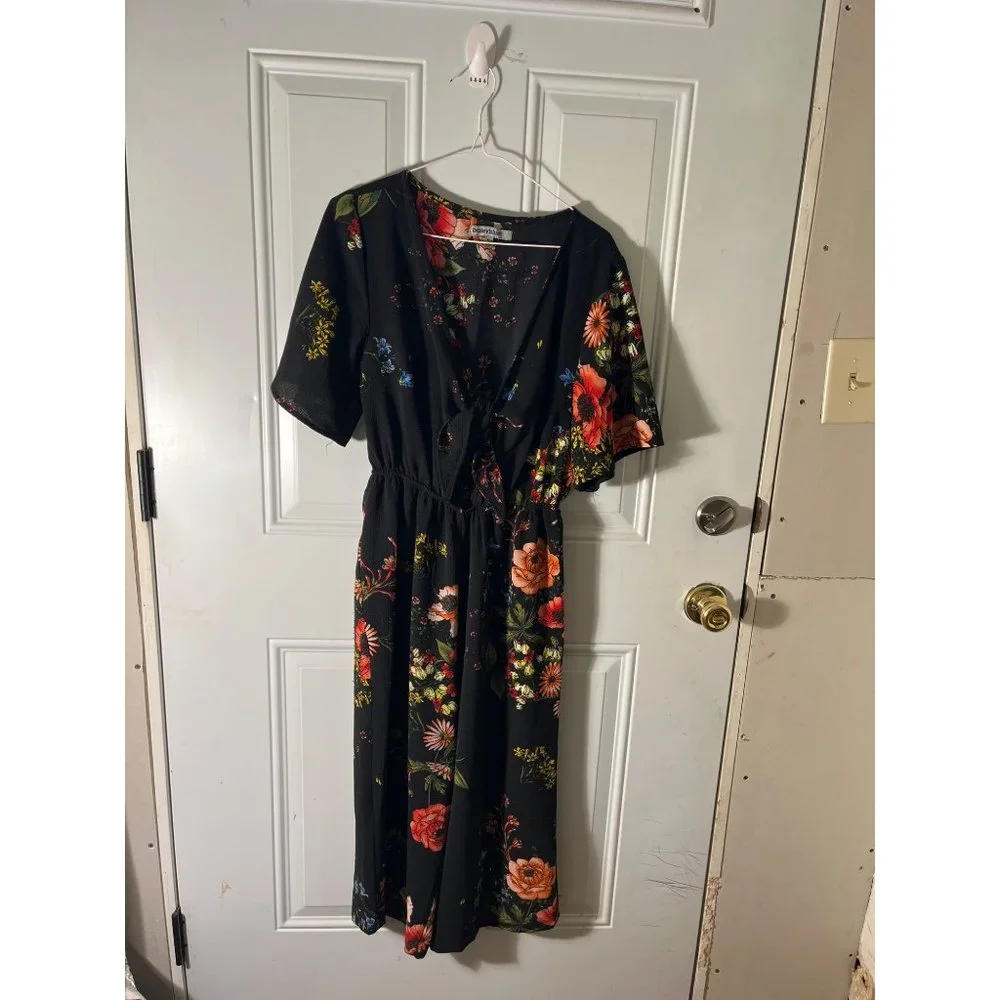 Bailey Blue woman’s v-neck black floral shirt sleeved one piece size medium.